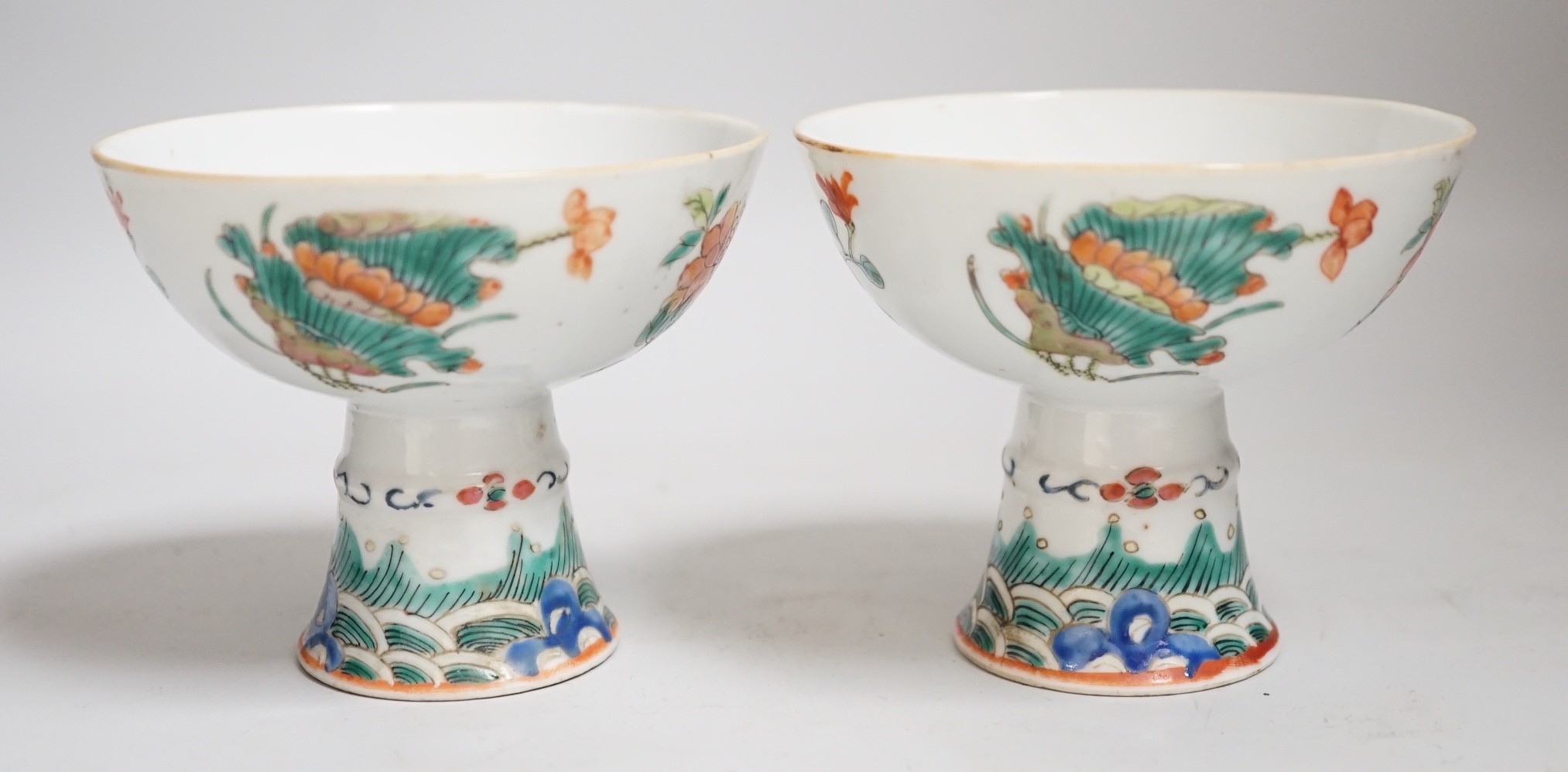 A pair of 19th century Chinese stem cups with four flower design, 9cm
